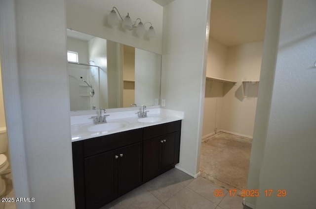 24646 N Barley Rd, Florence, AZ 85132 - bathroom featuring toilet, double vanity, and a walk in closet