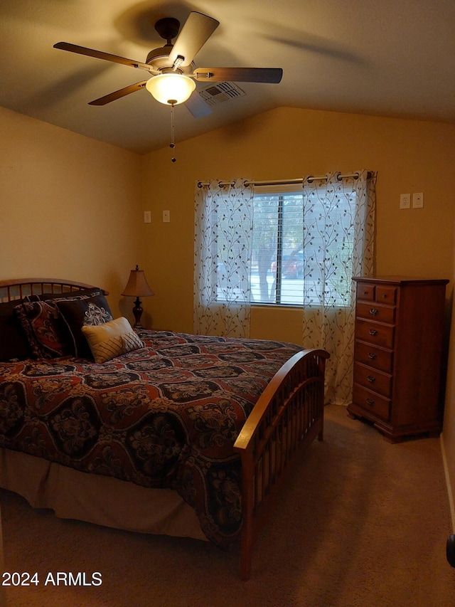 carpeted bedroom featuring ceiling fan and vaulted ceiling