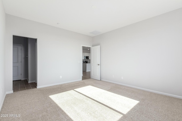 unfurnished bedroom with carpet floors