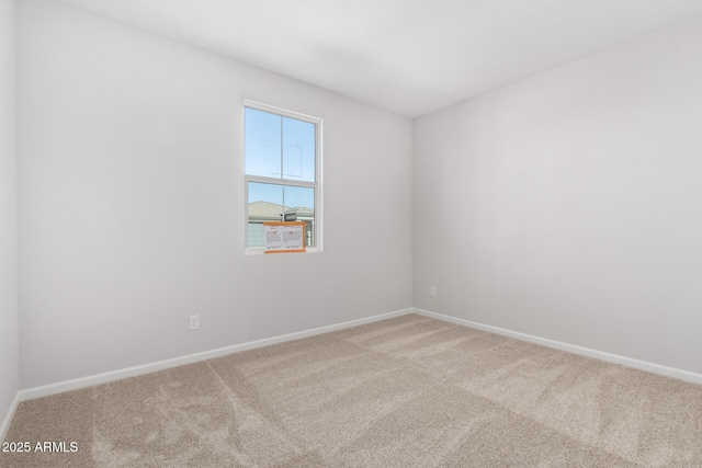 spare room with light colored carpet