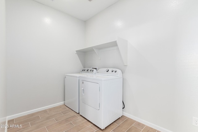 laundry area with washing machine and clothes dryer