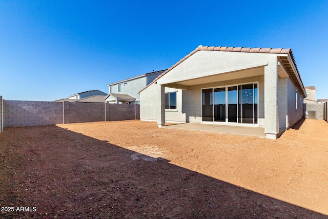 rear view of house with a patio