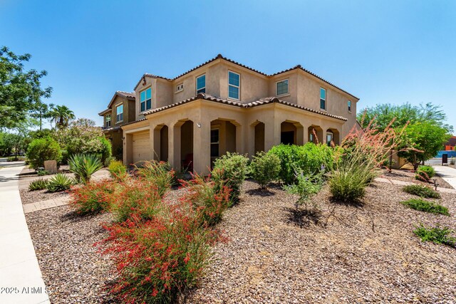 5016 S Curie Way, Mesa, AZ 85212 - mediterranean / spanish-style house with stucco siding, an attached garage, and a tile roof
