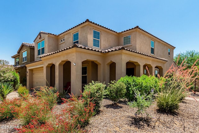 5016 S Curie Way, Mesa, AZ 85212 - mediterranean / spanish house featuring a garage, stucco siding, and a tiled roof