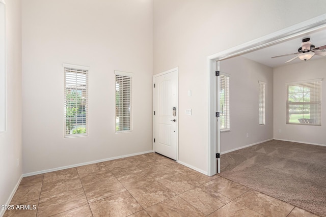 5016 S Curie Way, Mesa, AZ 85212 - unfurnished room featuring ceiling fan, a high ceiling, and light carpet