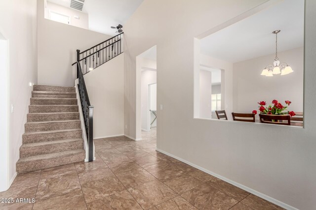 5016 S Curie Way, Mesa, AZ 85212 - stairway with a chandelier, plenty of natural light, and a high ceiling