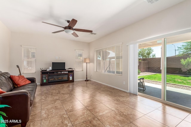 5016 S Curie Way, Mesa, AZ 85212 - living area with a ceiling fan and light tile patterned flooring