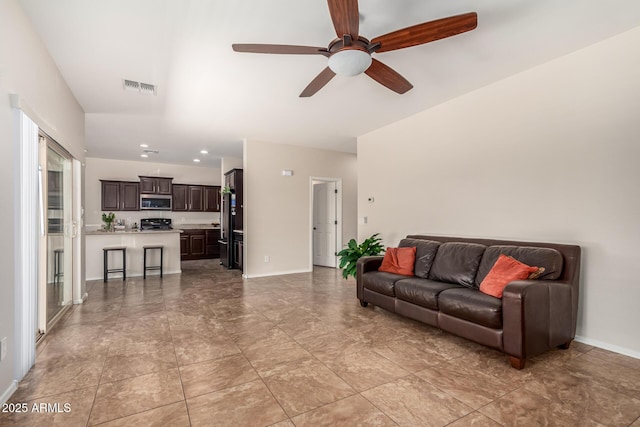 5016 S Curie Way, Mesa, AZ 85212 - living room with ceiling fan and baseboards