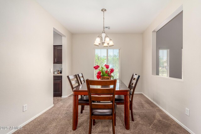 5016 S Curie Way, Mesa, AZ 85212 - dining space with a chandelier and carpet flooring