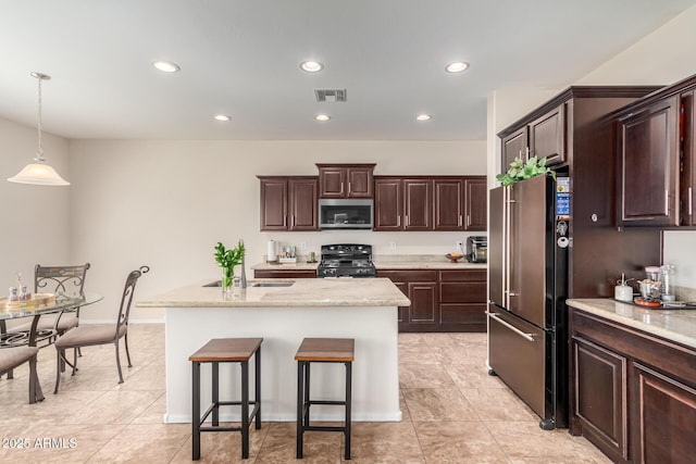 5016 S Curie Way, Mesa, AZ 85212 - kitchen featuring stainless steel microwave, high quality fridge, black stove, recessed lighting, and light tile patterned flooring