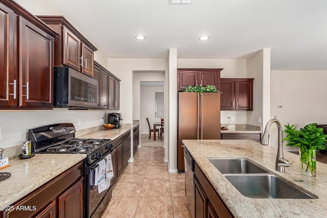5016 S Curie Way, Mesa, AZ 85212 - kitchen with appliances with stainless steel finishes, light stone counters, recessed lighting, and light tile patterned floors
