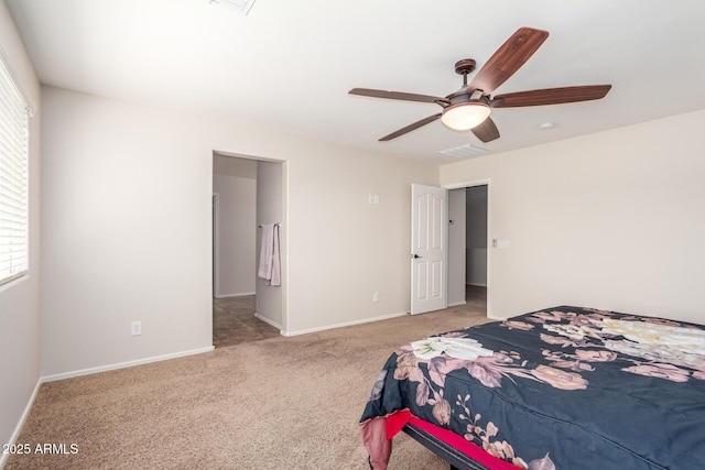 5016 S Curie Way, Mesa, AZ 85212 - carpeted bedroom with multiple windows and a ceiling fan