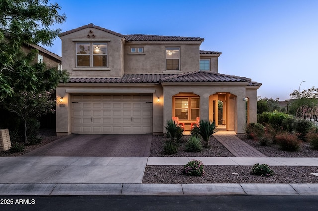5016 S Curie Way, Mesa, AZ 85212 - mediterranean / spanish home featuring stucco siding, driveway, a garage, and a tile roof