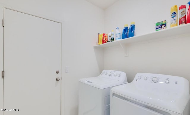 laundry area with washing machine and dryer and laundry area