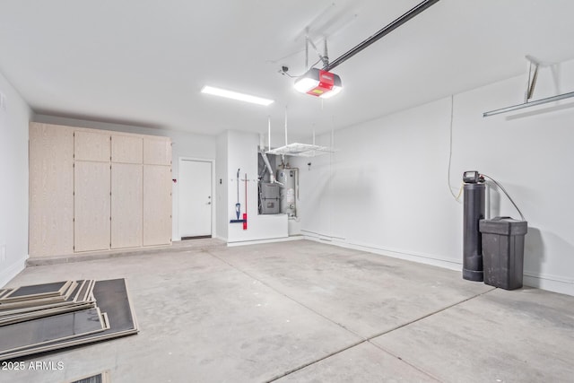 garage featuring a garage door opener and water heater