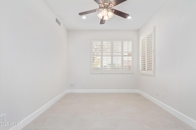 unfurnished room with ceiling fan