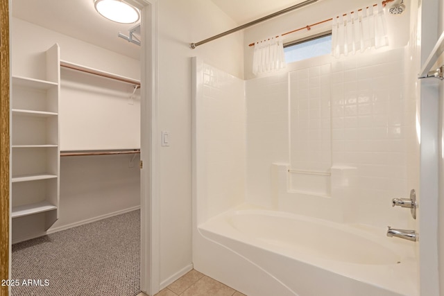 bathroom featuring shower / bathing tub combination and tile patterned flooring