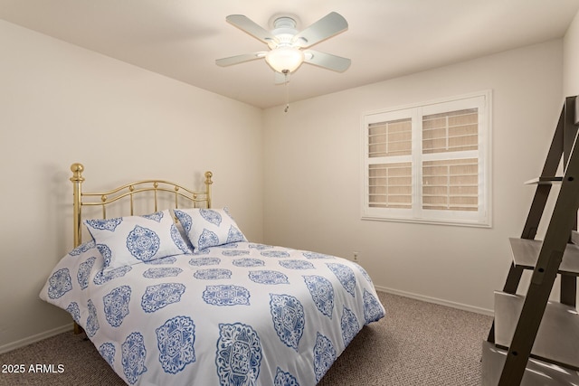 bedroom featuring ceiling fan and dark colored carpet