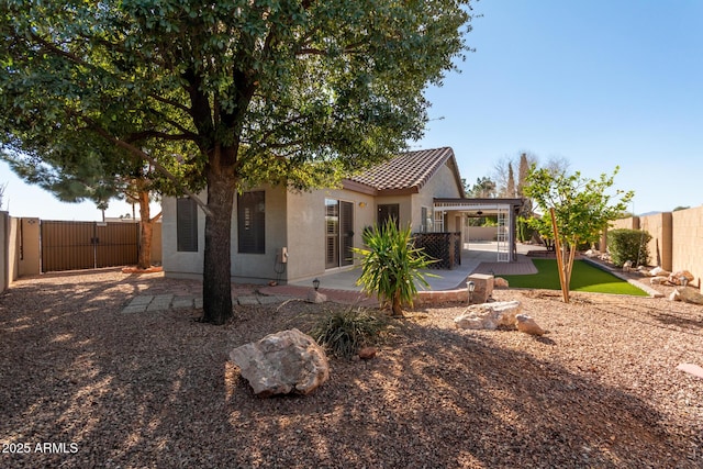 back of house featuring a patio