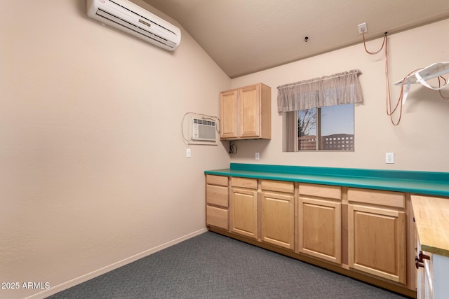 kitchen featuring dark colored carpet, wood counters, an AC wall unit, and lofted ceiling