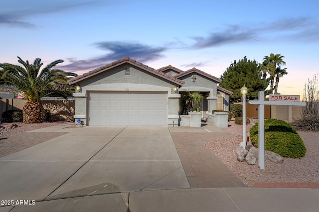 view of front of property featuring a garage