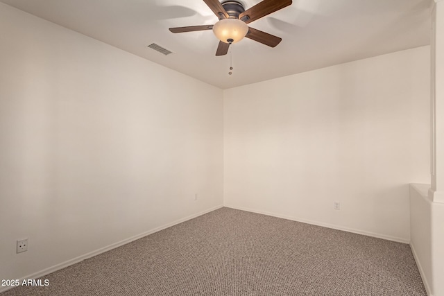 spare room with ceiling fan and carpet flooring