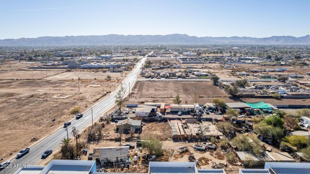 birds eye view of property featuring a mountain view