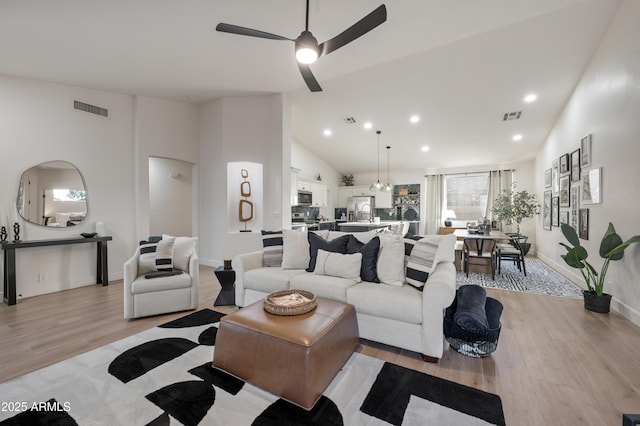 living room featuring visible vents and light wood-type flooring