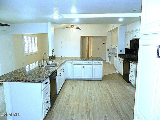 kitchen with ceiling fan, a sink, light wood-style floors, black appliances, and white cabinetry