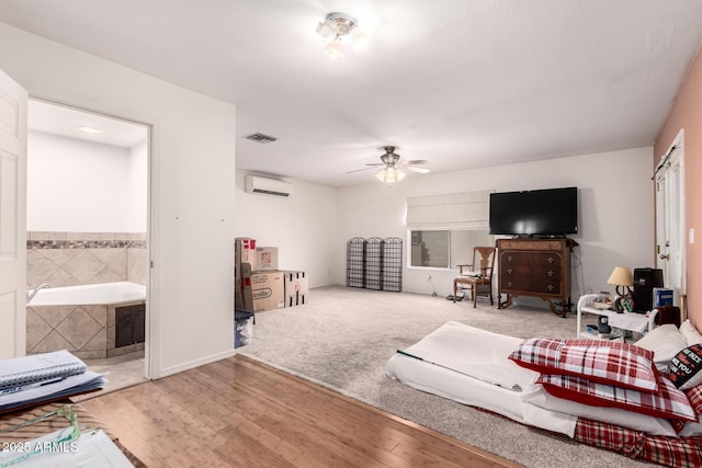 6908 W Sunnyside Dr, Peoria, AZ 85345 - living room with a wall mounted AC, ceiling fan, and wood finished floors