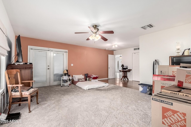 6908 W Sunnyside Dr, Peoria, AZ 85345 - living area with french doors, carpet, and a ceiling fan