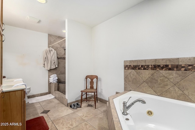 6908 W Sunnyside Dr, Peoria, AZ 85345 - full bath with a tub with jets, a shower stall, tile patterned floors, vanity, and baseboards