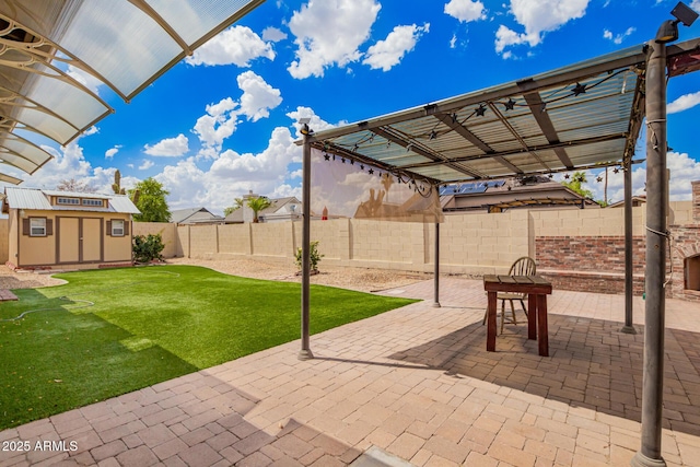 6908 W Sunnyside Dr, Peoria, AZ 85345 - view of patio featuring a storage unit, an outdoor structure, and a pergola