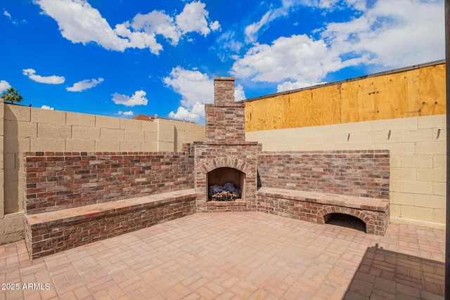 6908 W Sunnyside Dr, Peoria, AZ 85345 - view of patio featuring an outdoor brick fireplace and fence