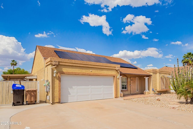 6908 W Sunnyside Dr, Peoria, AZ 85345 - view of front of home featuring a gate, driveway, solar panels, stucco siding, and fence