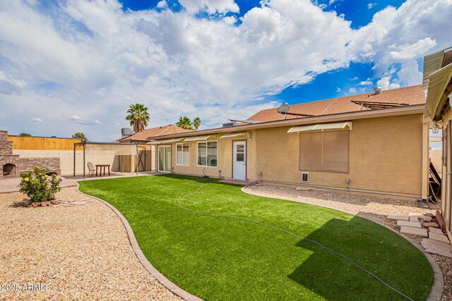 6908 W Sunnyside Dr, Peoria, AZ 85345 - back of house with a patio area, stucco siding, and roof with shingles