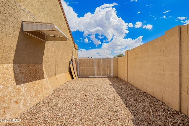 6908 W Sunnyside Dr, Peoria, AZ 85345 - view of yard featuring a gate and fence