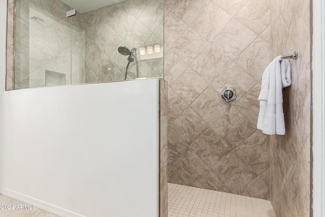 bathroom with a tile shower