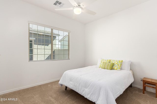 bedroom with ceiling fan and carpet floors