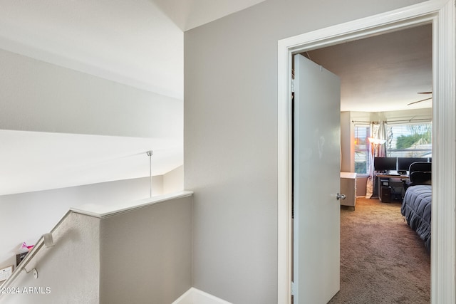 hallway featuring carpet flooring