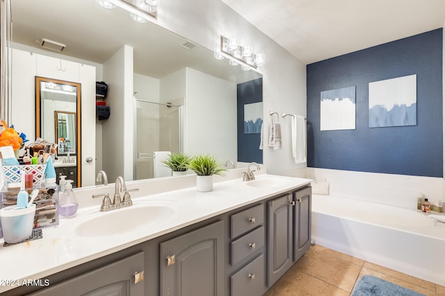 bathroom featuring tile patterned floors, vanity, and independent shower and bath