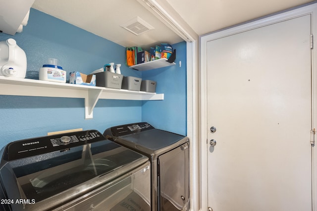 laundry area featuring washing machine and dryer