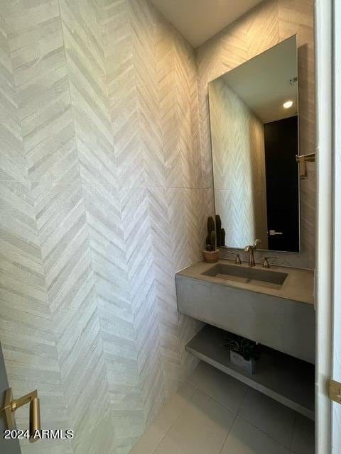 bathroom featuring tile flooring and sink