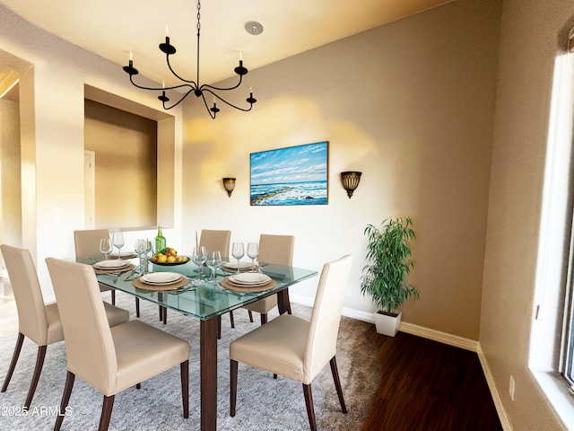 42023 N Bridlewood Way, Anthem, AZ 85086 - dining space with wood finished floors, baseboards, and a chandelier