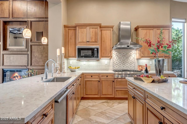 42023 N Bridlewood Way, Anthem, AZ 85086 - kitchen with wall chimney exhaust hood, a sink, stainless steel appliances, tasteful backsplash, and light stone counters