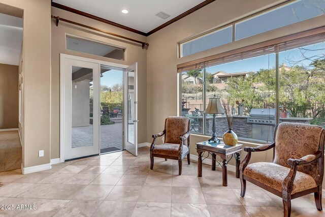 42023 N Bridlewood Way, Anthem, AZ 85086 - sitting room with crown molding, healthy amount of natural light, baseboards, light tile patterned floors, and recessed lighting