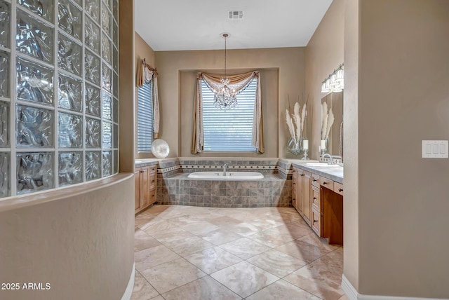 42023 N Bridlewood Way, Anthem, AZ 85086 - bathroom featuring a chandelier, vanity, a bath, and tile patterned floors