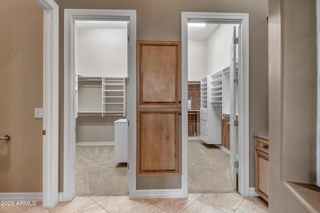 42023 N Bridlewood Way, Anthem, AZ 85086 - spacious closet featuring light colored carpet and light tile patterned floors