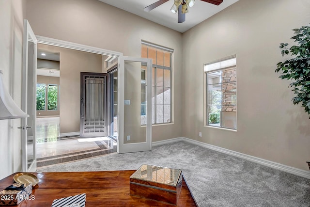 42023 N Bridlewood Way, Anthem, AZ 85086 - carpeted foyer entrance with a ceiling fan, baseboards, and french doors
