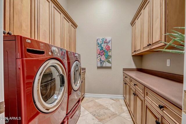 42023 N Bridlewood Way, Anthem, AZ 85086 - laundry room featuring cabinet space, washer and clothes dryer, and baseboards